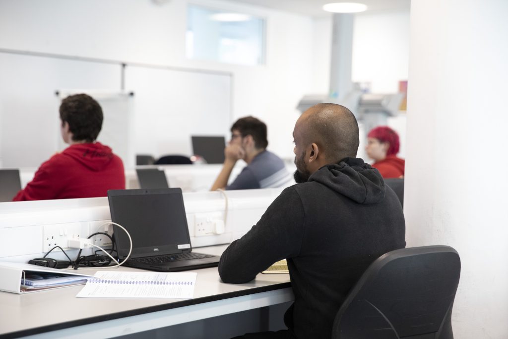 Several NPL Metrology Apprentices sitting in a classroom.