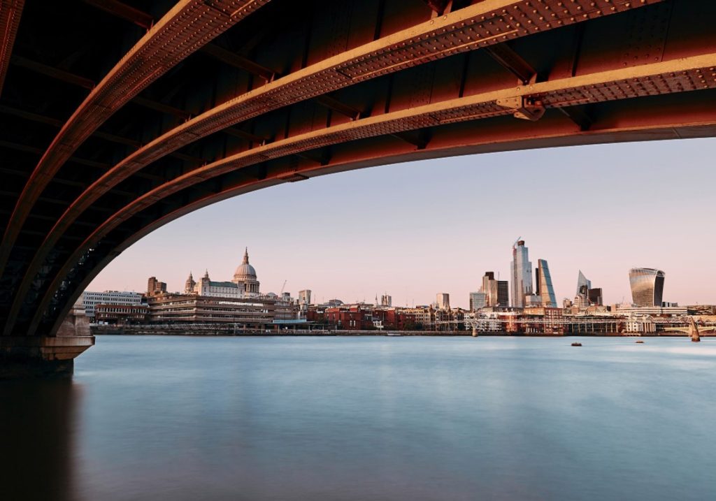 The London skyline from St Pauls to Aldgate with the Thames in the foreground.