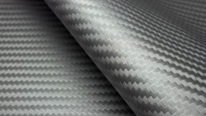 Sheets of flexible, shiny silver coloured composite material.